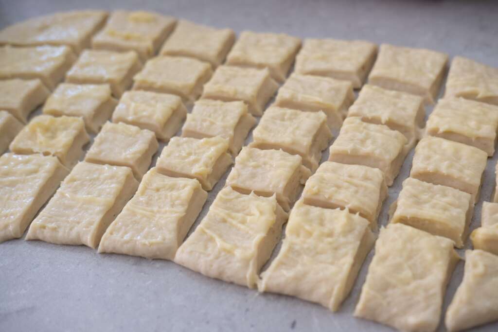 Cut the dough into equal squares. 