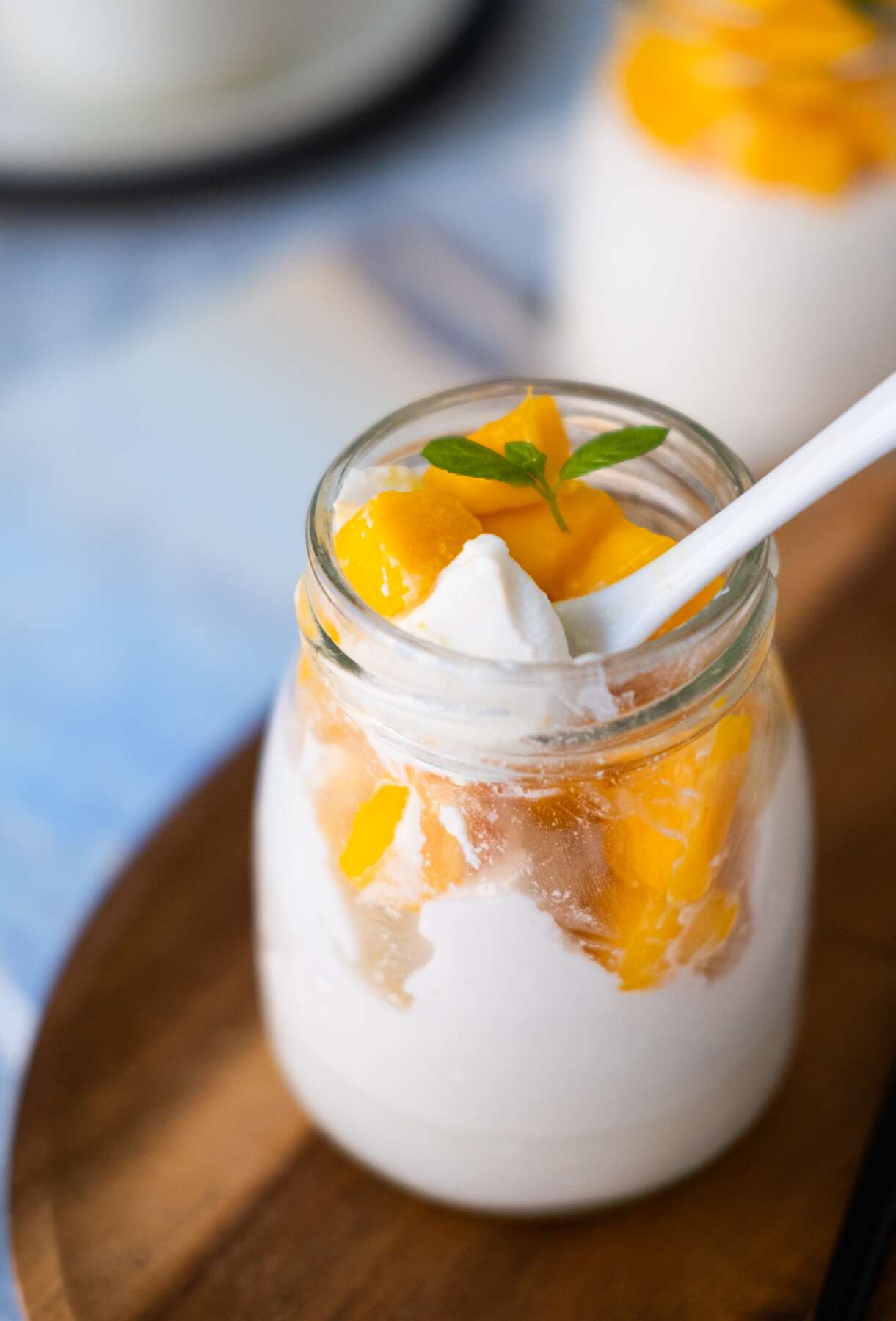 Scoop the mango coconut pudding with a spoon.