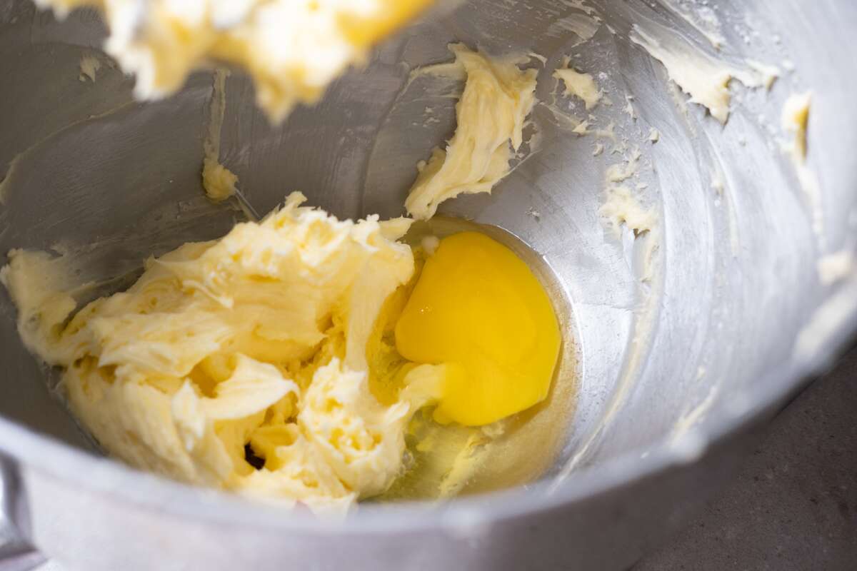 Add egg to the butter mixture one at each time. 